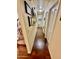 Long hallway with hardwood floors and wall shelving at 4444 E Wildwood Dr, Phoenix, AZ 85048