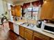 Bright kitchen features double sink, dishwasher, and ample cabinetry at 4444 E Wildwood Dr, Phoenix, AZ 85048