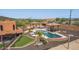 Aerial view of the property showcasing the pool, spa, and putting green at 47012 N New River Rd, New River, AZ 85087