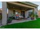 Covered patio with seating area, perfect for outdoor entertaining at 6234 W Maya Dr, Phoenix, AZ 85083