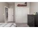 Well-lit bedroom with ample closet space and dresser at 6234 W Maya Dr, Phoenix, AZ 85083