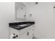 Modern bathroom with white cabinets and black countertop at 6425 W Campbell Ave, Phoenix, AZ 85033