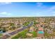 Aerial view of a neighborhood with a lake and houses with pools at 841 E Runaway Bay Pl, Chandler, AZ 85249