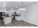 Modern kitchen with white cabinets, stainless steel appliances, and an island at 841 E Runaway Bay Pl, Chandler, AZ 85249