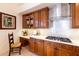 Well-equipped kitchen with gas cooktop and built-in desk at 9339 E Sandy Vista Dr, Scottsdale, AZ 85262