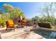 Inviting pool area with fireplace and comfortable seating at 9339 E Sandy Vista Dr, Scottsdale, AZ 85262