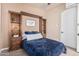 Bedroom with built-in shelving and a comfortable bed at 945 W Elm St, Litchfield Park, AZ 85340