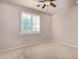 Well-lit bedroom with plantation shutters and ceiling fan at 945 W Elm St, Litchfield Park, AZ 85340