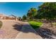 Community walking path with landscaping and homes at 945 W Elm St, Litchfield Park, AZ 85340