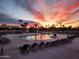 Relaxing community pool area with lounge chairs and sunset views at 1033 S Florence Dr, Mesa, AZ 85208