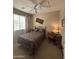 Bedroom with a bed, desk, and ceiling fan at 14028 N Edgeworth N Dr # A, Fountain Hills, AZ 85268