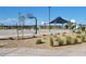 Community basketball court with shade structure and benches at 18355 W Smoketree Dr, Wittmann, AZ 85361