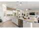 Spacious kitchen boasts granite countertops, stainless steel appliances, and white cabinetry at 1915 N Bernard Cir, Mesa, AZ 85207