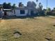 Large grassy front yard with mature trees and a walkway at 2045 W Orange Dr, Phoenix, AZ 85015