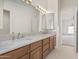 Double vanity bathroom with granite countertop and tiled floor at 4110 E Mercer Ln, Phoenix, AZ 85028