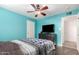 Bedroom with a bed, ceiling fan, and flat-screen TV at 456 N 96Th Pl, Mesa, AZ 85207