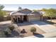 One-story home with landscaped yard and a two-car garage at 4719 W Silva Dr, New River, AZ 85087