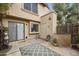 Private backyard with wooden fence, stone accents, and patio rug at 4901 E Kelton Ln # 1006, Scottsdale, AZ 85254