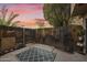 Private backyard with wooden fence, stone accents, and patio rug at 4901 E Kelton Ln # 1006, Scottsdale, AZ 85254