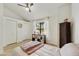 Bedroom with twin bed, ceiling fan, and large window at 4901 E Kelton Ln # 1006, Scottsdale, AZ 85254