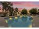 Inviting community pool area at sunset at 4901 E Kelton Ln # 1006, Scottsdale, AZ 85254