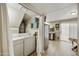 Stackable washer and dryer, extra storage, and view of kitchen at 4901 E Kelton Ln # 1006, Scottsdale, AZ 85254
