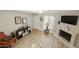 Living room with fireplace, hardwood floors, and ample natural light at 4901 E Kelton Ln # 1006, Scottsdale, AZ 85254