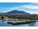 Picturesque golf course with water features and mountain backdrop at 6237 S Moccasin Trl, Gilbert, AZ 85298