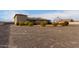 Large backyard with gravel, gazebo, and mature shrubs at 6523 N 135Th Dr, Glendale, AZ 85307
