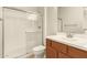 Bathroom with a walk-in shower and wood cabinets at 6523 N 135Th Dr, Glendale, AZ 85307