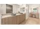 Elegant bathroom with double vanity and granite countertops at 6523 N 135Th Dr, Glendale, AZ 85307