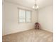 Well-lit bedroom with neutral decor and carpeted floors at 6523 N 135Th Dr, Glendale, AZ 85307