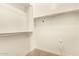 Large walk-in closet with double hanging rods and shelving at 6523 N 135Th Dr, Glendale, AZ 85307