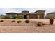 One-story home with a three-car garage and desert landscaping at 6523 N 135Th Dr, Glendale, AZ 85307