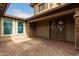 Elegant double front doors and a brick walkway leading to the entry at 6523 N 135Th Dr, Glendale, AZ 85307