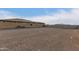 House exterior with a large backyard and gravel at 6523 N 135Th Dr, Glendale, AZ 85307