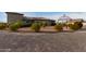 House exterior with a large backyard, gazebo, and landscaping at 6523 N 135Th Dr, Glendale, AZ 85307
