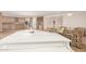 Open concept kitchen with light wood cabinets and granite counters at 6523 N 135Th Dr, Glendale, AZ 85307