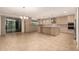 Spacious kitchen with granite countertops, stainless steel appliances, and an island at 6523 N 135Th Dr, Glendale, AZ 85307
