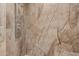 Walk-in shower with rainfall shower head and marble tile at 6523 N 135Th Dr, Glendale, AZ 85307