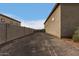 Long side yard with a gate and block wall at 6523 N 135Th Dr, Glendale, AZ 85307