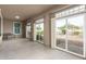 Bright sunroom with sliding glass doors to backyard at 6523 N 135Th Dr, Glendale, AZ 85307