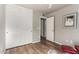 Bedroom with double doors and a red chair at 714 W Fogal Way, Tempe, AZ 85282