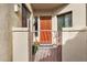 Inviting entryway with a wood door and wrought iron gate at 7445 E Eagle Crest Dr # 1093, Mesa, AZ 85207