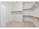 Spacious walk-in closet with ample shelving and hanging rods at 7591 N 87Th Ave, Glendale, AZ 85305