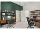 Functional home office with two desks and built-in shelving at 7591 N 87Th Ave, Glendale, AZ 85305