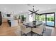 Open concept kitchen and dining area with modern cabinetry, island, and access to backyard at 8302 N 86Th St, Scottsdale, AZ 85258