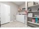 Laundry room with washer, dryer, and storage at 8522 W Georgetown Way, Florence, AZ 85132