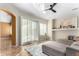 Living room with sectional sofa, sliding doors, and white shutters at 8601 W Chickasaw St, Tolleson, AZ 85353