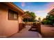 Covered patio, gated side yard, and neatly kept landscaping at 9635 W Spanish Moss Ln, Sun City, AZ 85373